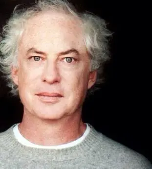 Man with gray hair and sweater