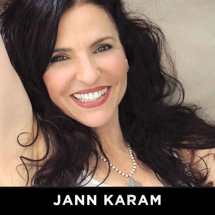 Happy woman with necklace and dark hair