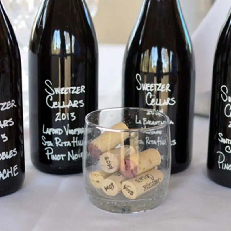 Three Sweetzer Cellars wine bottles displayed